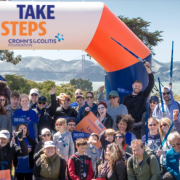 A crowd of people at the finish line of the Take Steps walk
